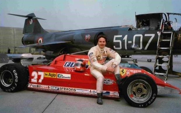 Villeneuve posing on his Ferrari in front of the F-104, on November 21st, 1981.