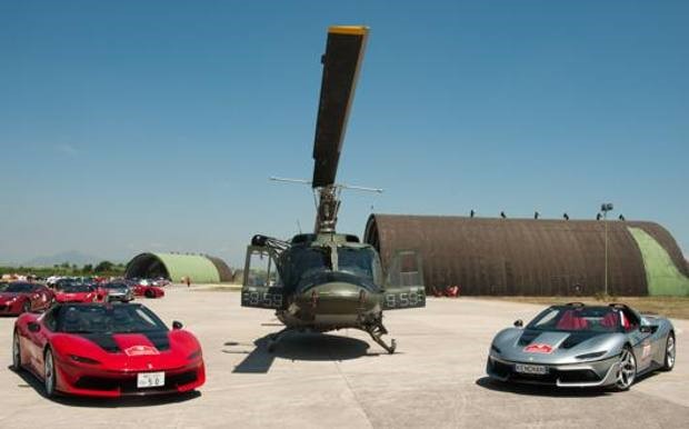 Two Ferraris and an helicopter.