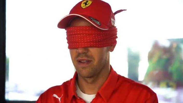 A blindfolded Sebastian Vettel.