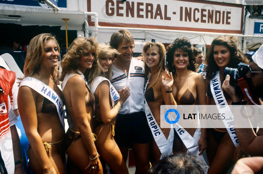 Le Mans 24 hours, 18-19 June 1983. Derek Bell (Porsche 956), 2nd position, with the Hawaiian Tropic girls in the paddock. 