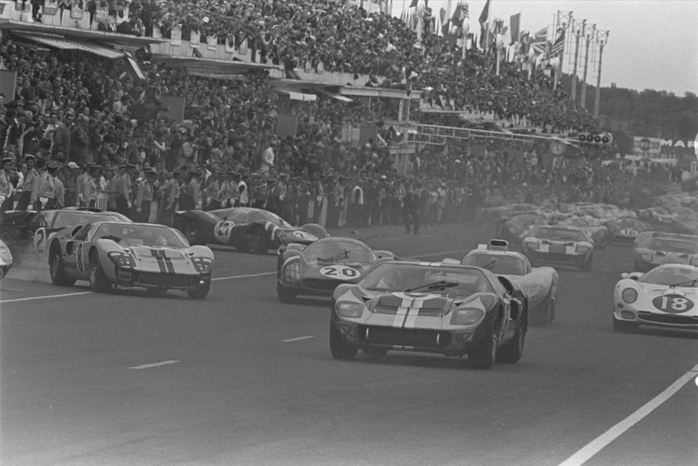 June 18, 1966. Ford and Ferrari jockey for position during the typically chaotic Le Mans start.