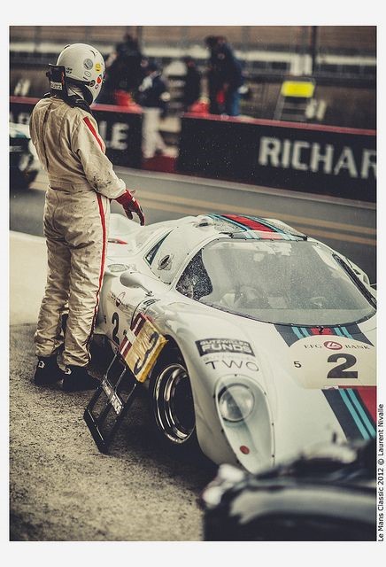 A driver and a racing car at Le Mans.
