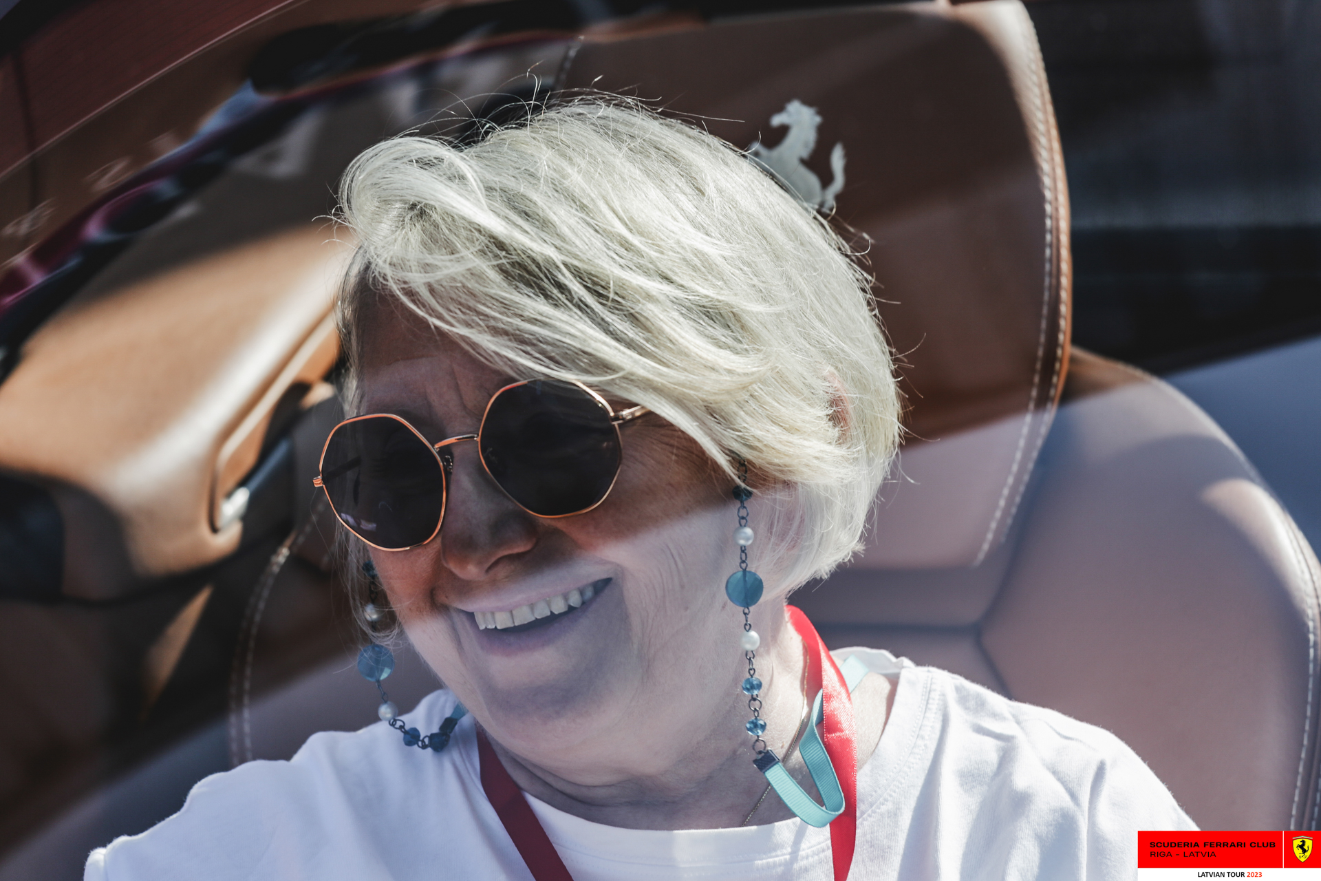 A Ferrari owner in her Ferrari. 