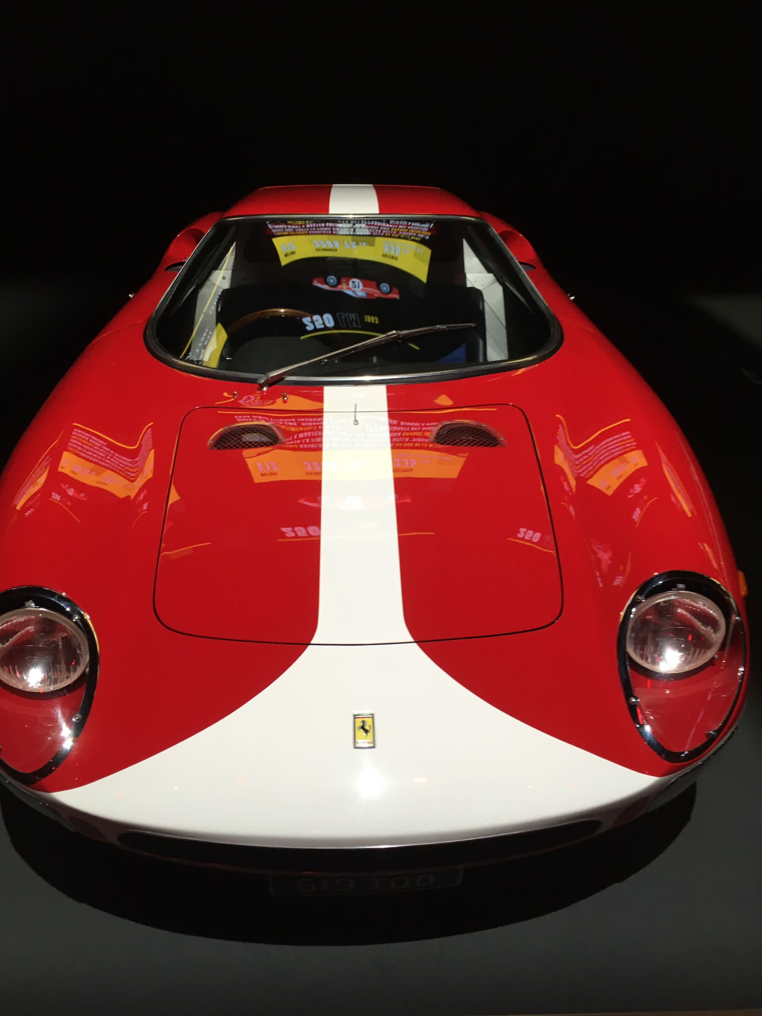 A vintage red and white Ferrari.