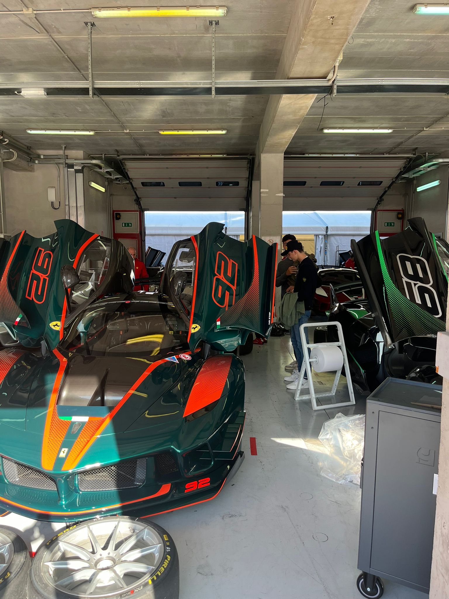 2 Ferraris in a garage.