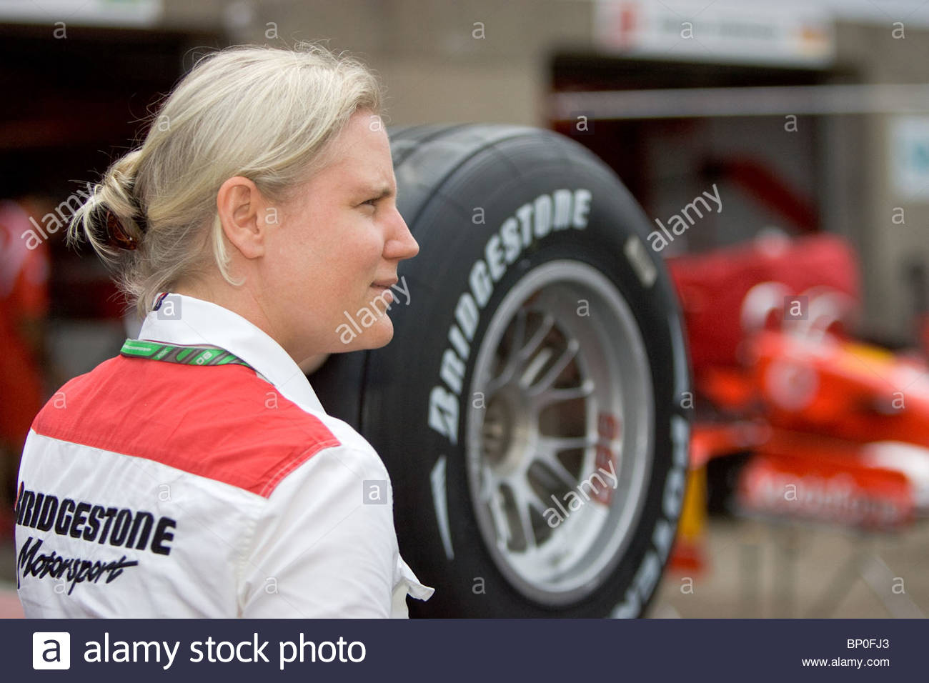 A woman and a Bridgestone tyre.