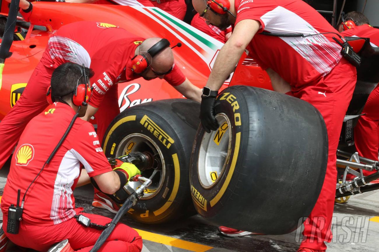 Mechanics and tyres in the Ferrari pits.