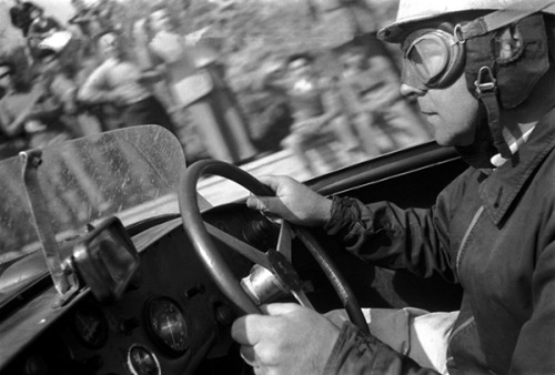 A vintage racing driver in action.
