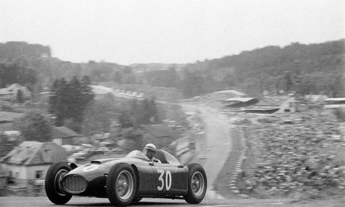 Eugenio Castellotti comes over the top of Radillon after Eau Rouge in the Lancia D-50, during the Belgian Grand Prix at Spa Francorchamps, 5th June 1955.