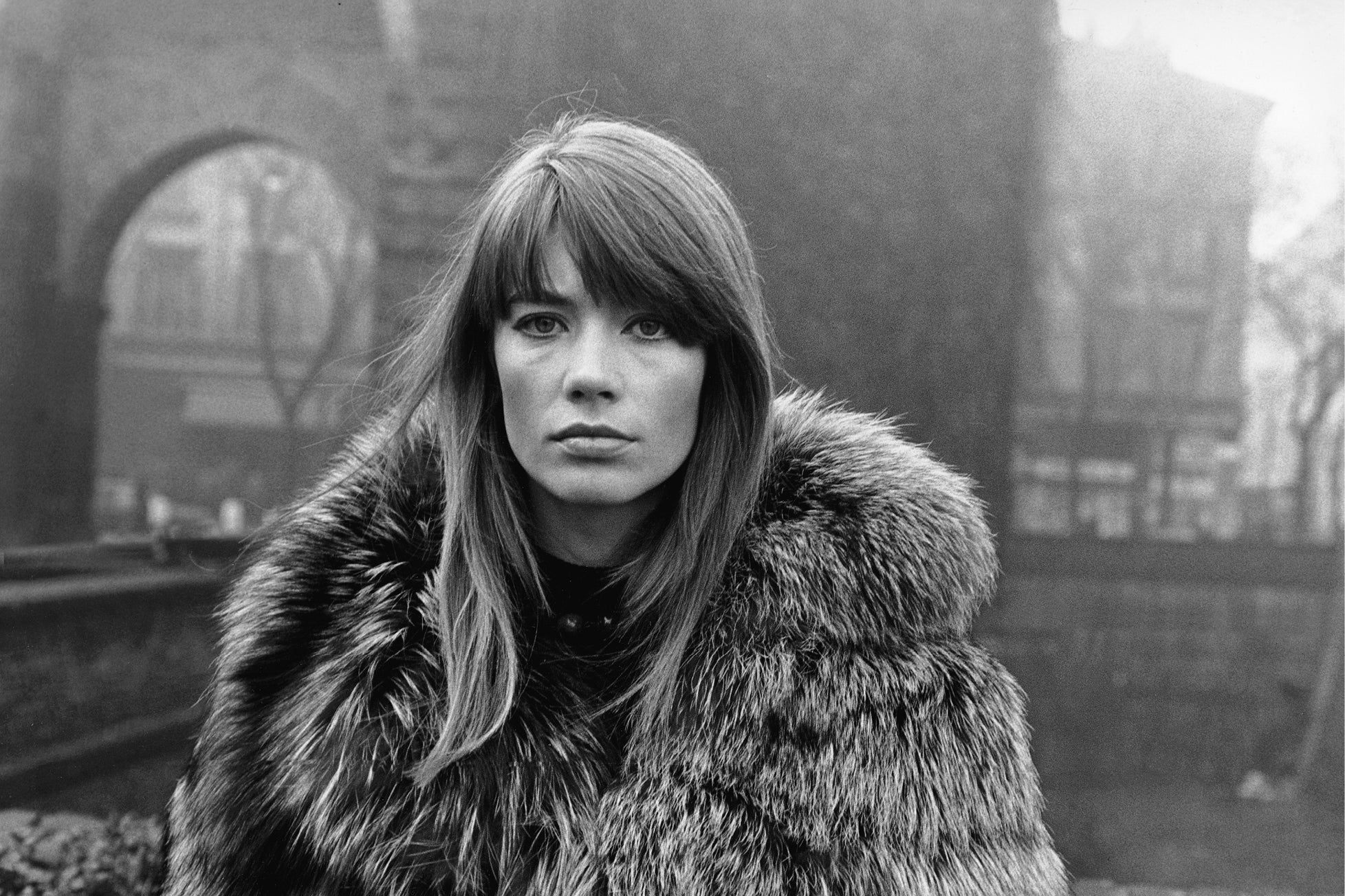 The French singer and actress Françoise Hardy wearing a fur coat in Piazza Sant'Ambrogio. Milan, 1960s. 
