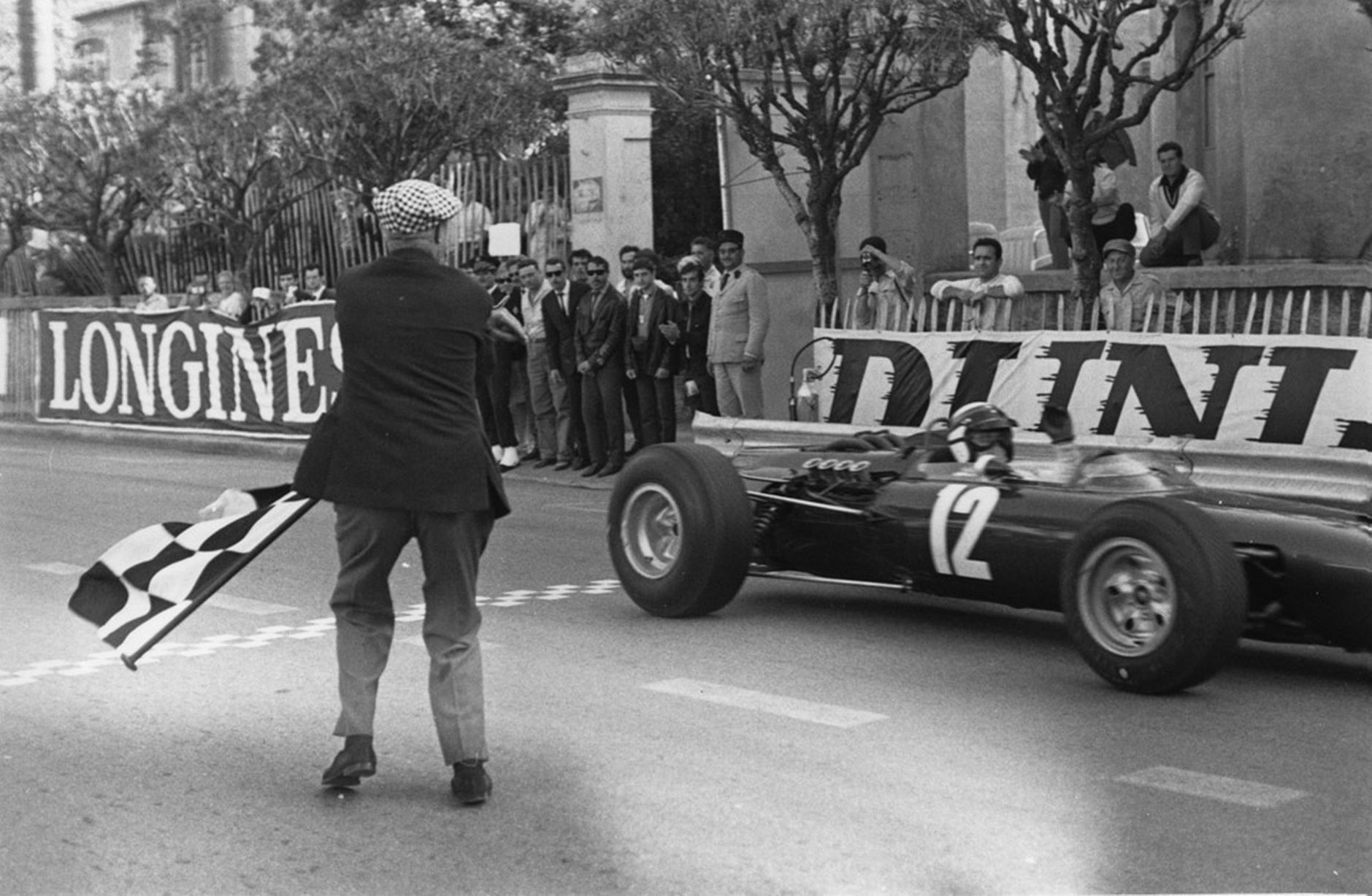 Jackie Stewart taking the checkered flag to win the Monaco GP on 22 May 1966. 