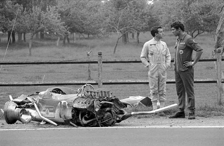 Jackie Oliver, GBR, (left) and a Lotus mechanic wonder how Jackie was able to walk away from the Lotus 49B after a violent accident in practice at the French Grand Prix in Rouen-les-Essarts on 7 July 1968.
