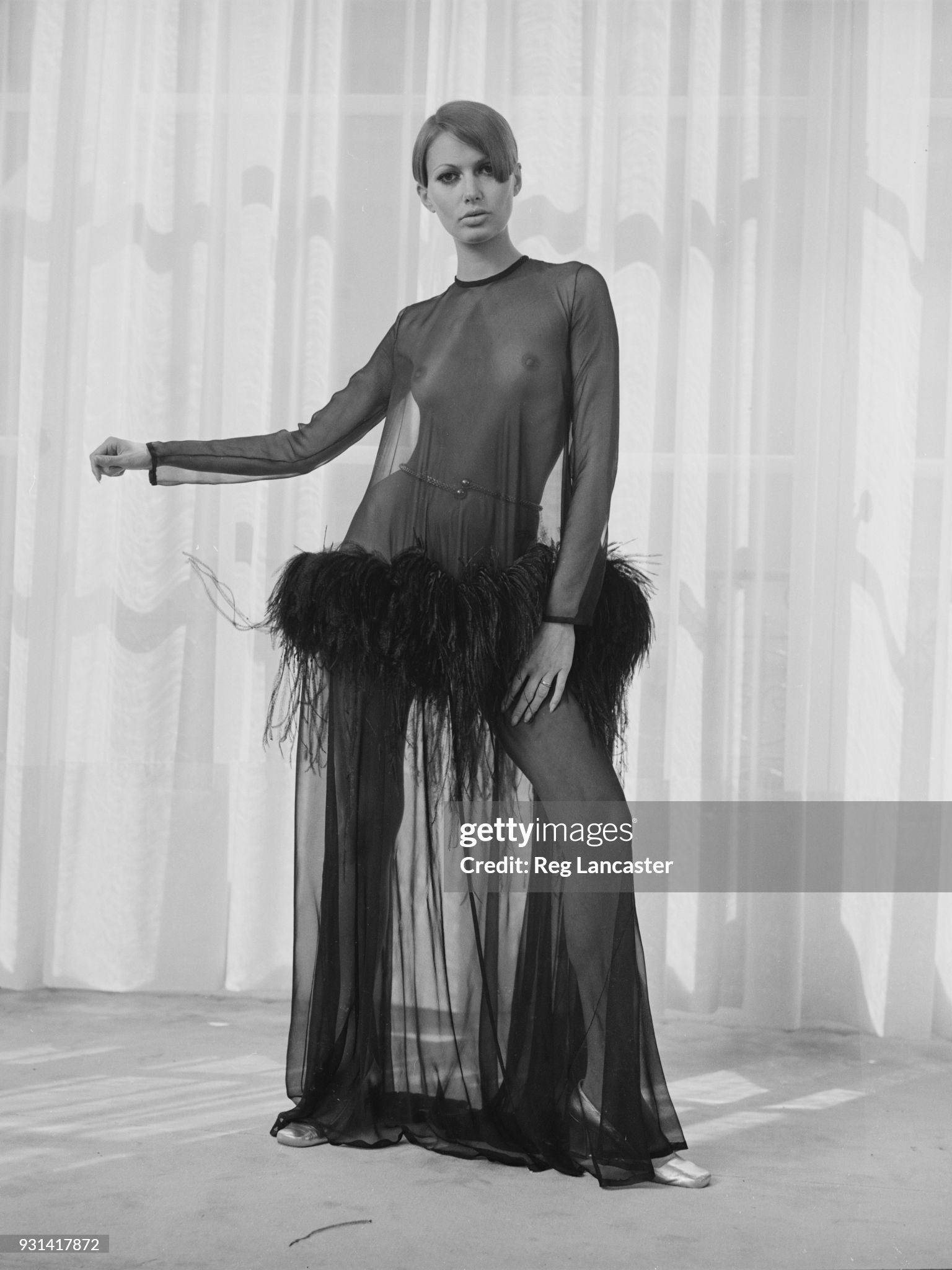 A fashion model wearing an Yves Saint Laurent see through long dress in Paris, France, on 19th August 1968. 