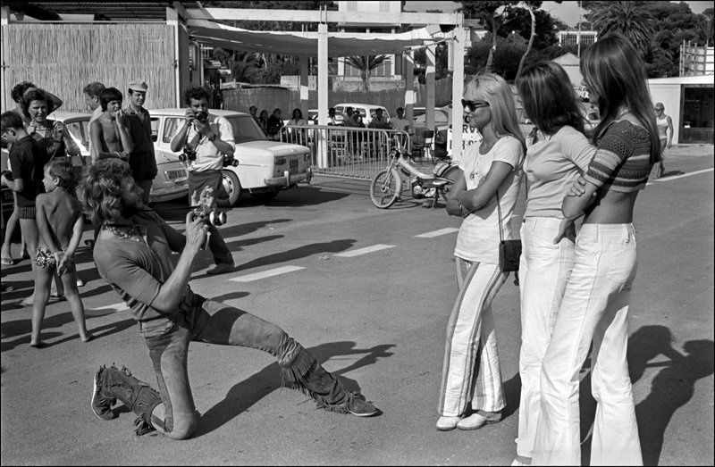 Johnny Hallyday taking a picture of Sylvie Vartan, Sheila and Françoise Hardy in Saint Raphael, France, in August 1969.