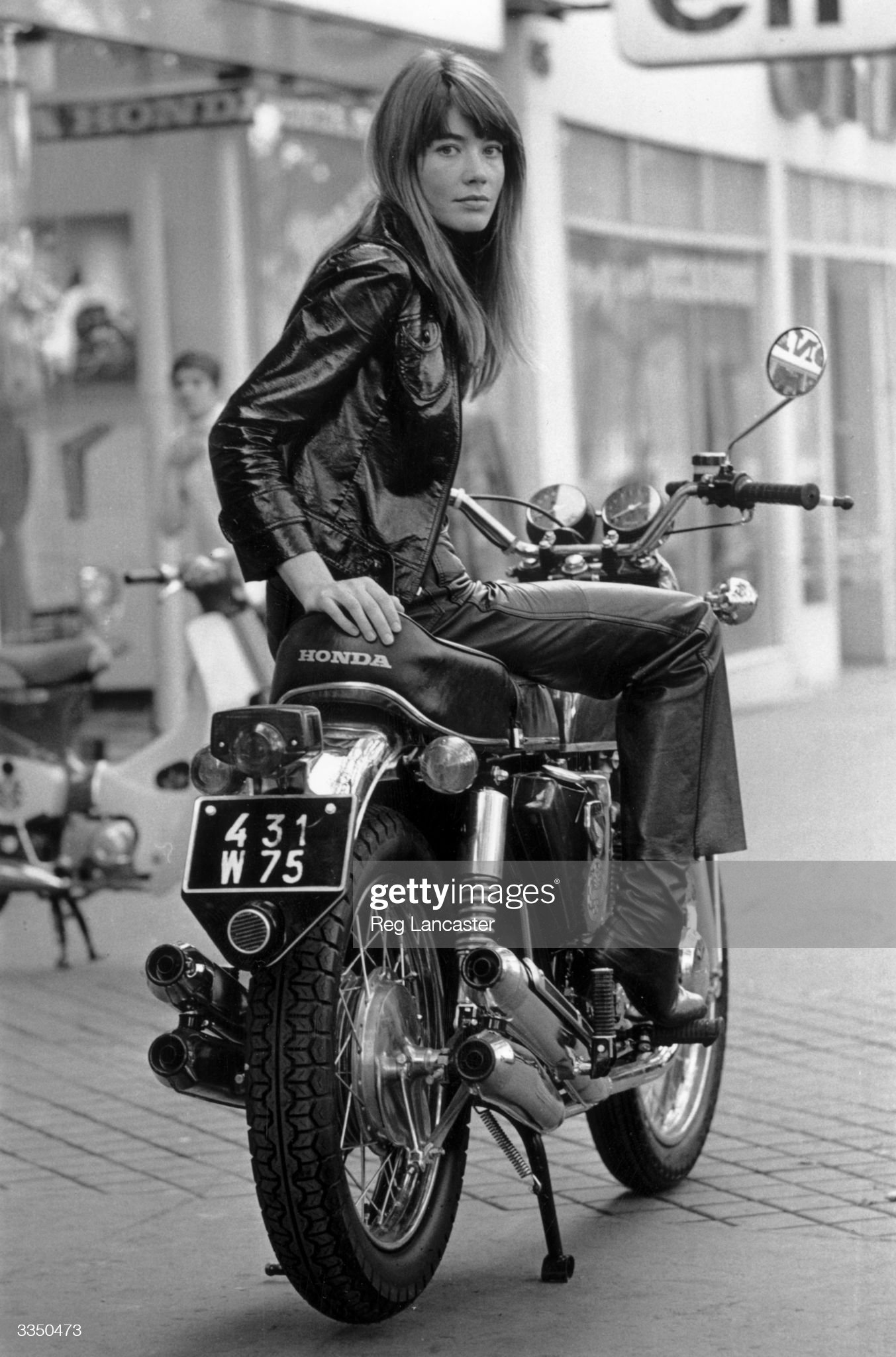 Françoise Hardy sitting on a Honda CB 750 motorcycle in Paris on 25th October 1969. 