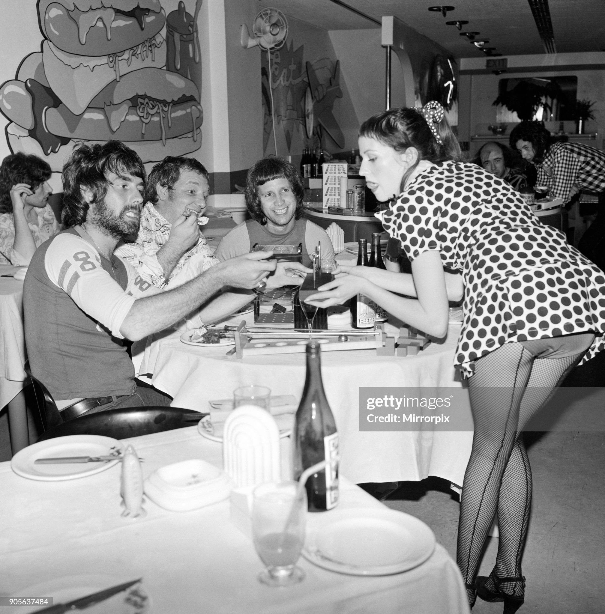 Mr. Freedom's restaurant at 20 Kensington Church street, London, on 30th July 1971. Games mistress Doni with customers and Mr. Freedom’s owner Tommy Roberts, second left, trying out some of the new games.