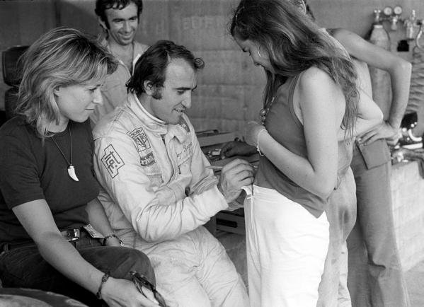 Clay Regazzoni signs his autograph in an unusual place for a fan at the Austrian GP on 13 August 1972.