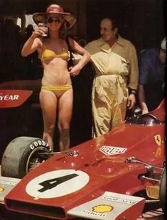 A girl in a bikini and a Ferrari 312B3 at the French Grand Prix in Paul Ricard on July 01, 1973.