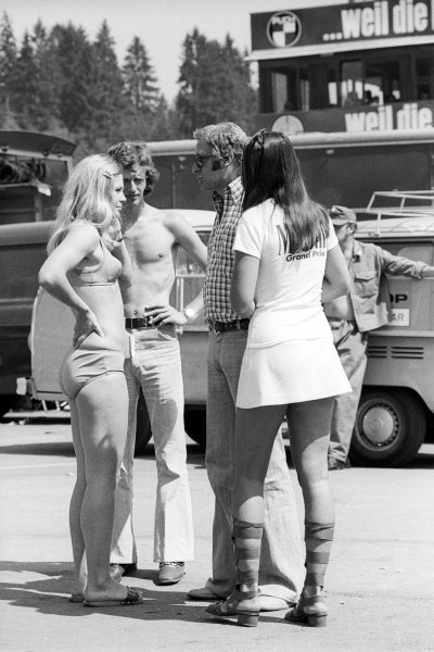 The hot weather necessitated a lack of clothing by some in the paddock of the Austrian Grand Prix at Osterreichring on 19 August 1973.