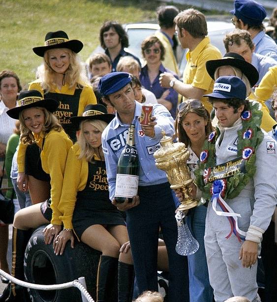 Jody Scheckter on the podium with JPS girls at Brands Hatch on 20 July 1974.