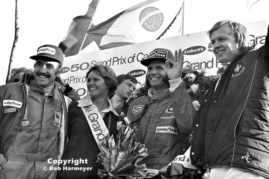 Emerson Fittipaldi, Clay Regazzoni and Ronnie Peterson on the podium at the Canadian GP held in Mosport Park on 22 September 1974. 