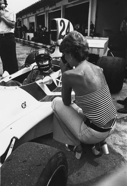 A driver in his car and a girl at the Brazilian Grand Prix in Interlagos, Sao Paulo, on 26 January 1975.