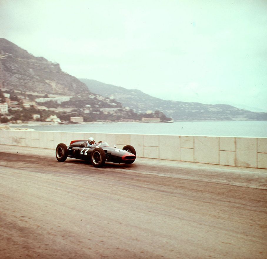 A vintage car racing in Monaco.