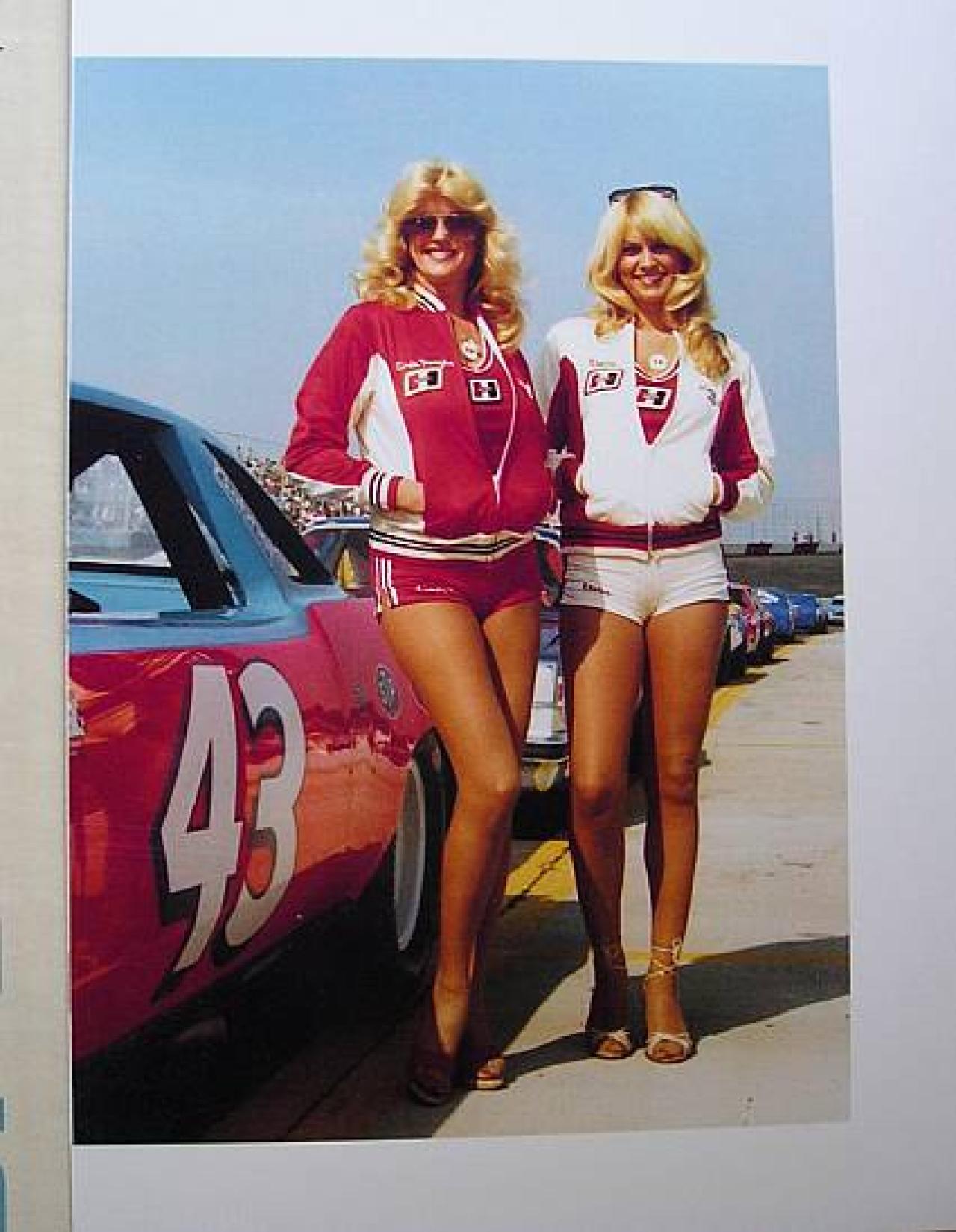 Linda Vaughn and another beautiful Hurst Shifter girl hang out next to Richard Petty's STP Oldsmobile Cutlass. 