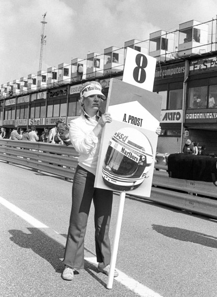 The grid girl for Alain Prost, McLaren, at Zandvoort on 31 August 1980. 