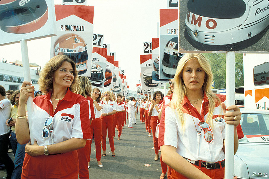 Grid girls marching in lines with driver signs at the Italian Grand Prix in Imola on 14 September 1980. 