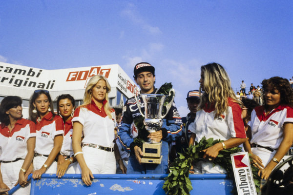 Michele Alboreto, Minardi, on the podium with girls at the 1981 European F2 Championship on 06 September 1981.