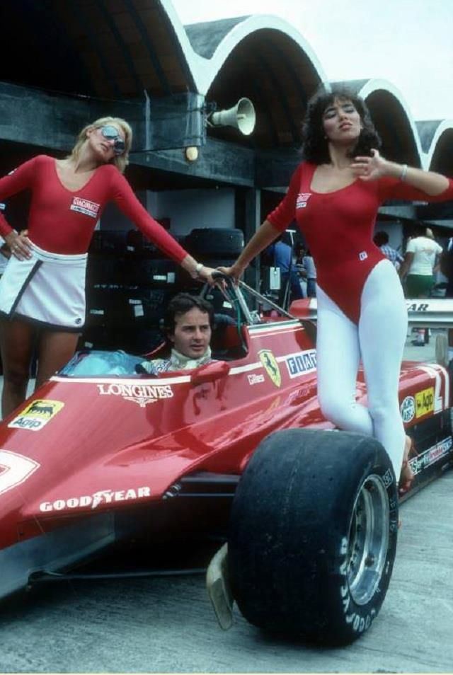 Gilles Villeneuve in his Ferrari with two Giacobazzi Lambrusco girls at the Brazilian Grand Prix in Jacarepaguá, Rio de Janeiro, on 21 March 1982.