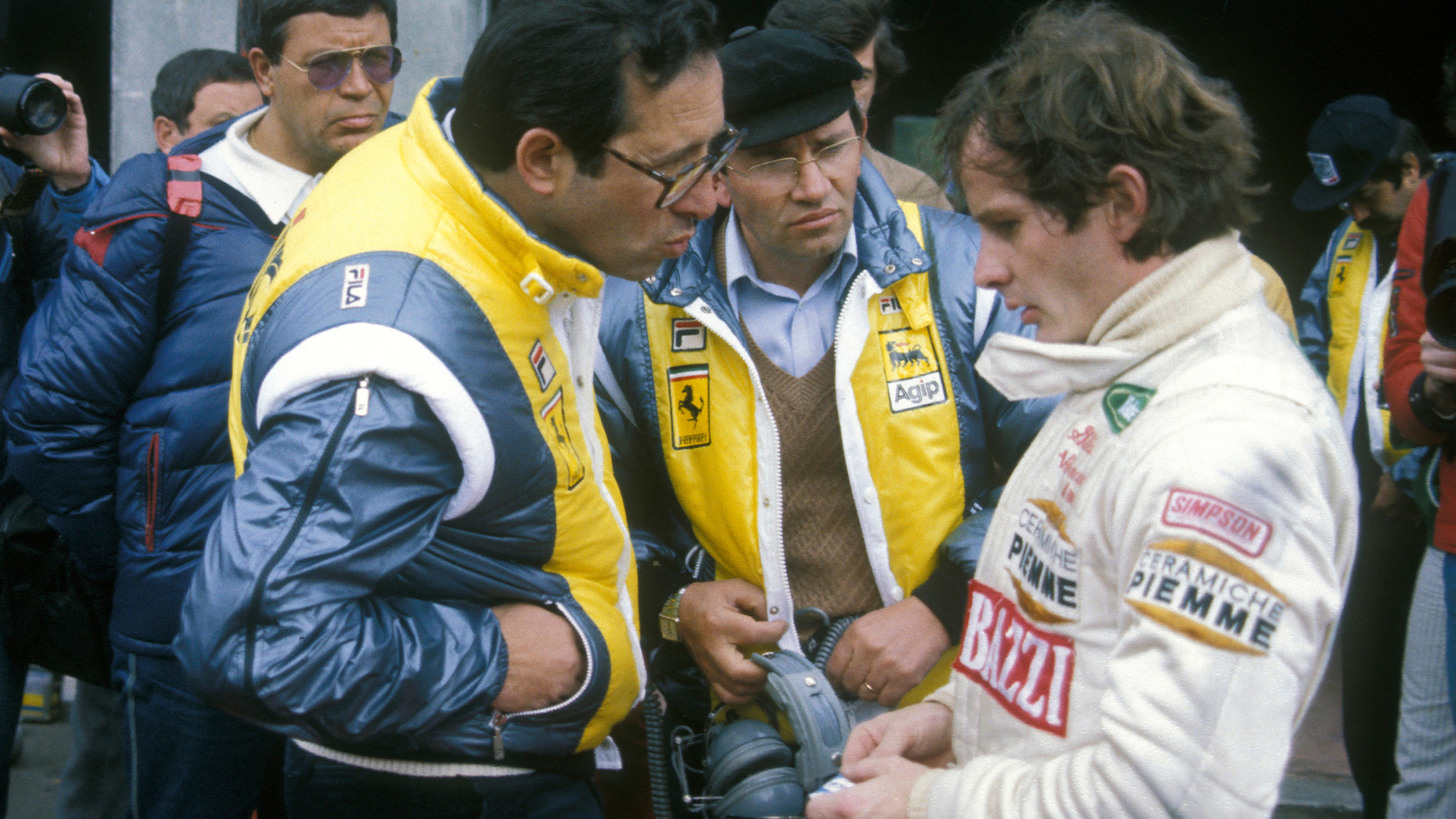 Mauro Forghieri and Antonio Tomaini speak to Gilles Villeneuve moments before he goes out for his final fateful practice at Zolder on 08 May 1982.