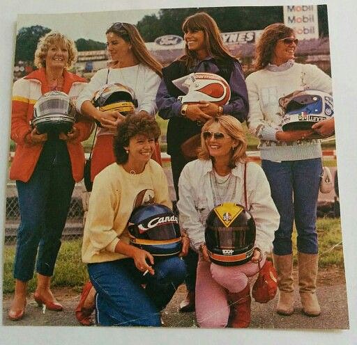 GP drivers’ wives and girlfriends brazenly flaunting their other halves’ helmets in the paddock at Brands Hatch on 18 July 1982.