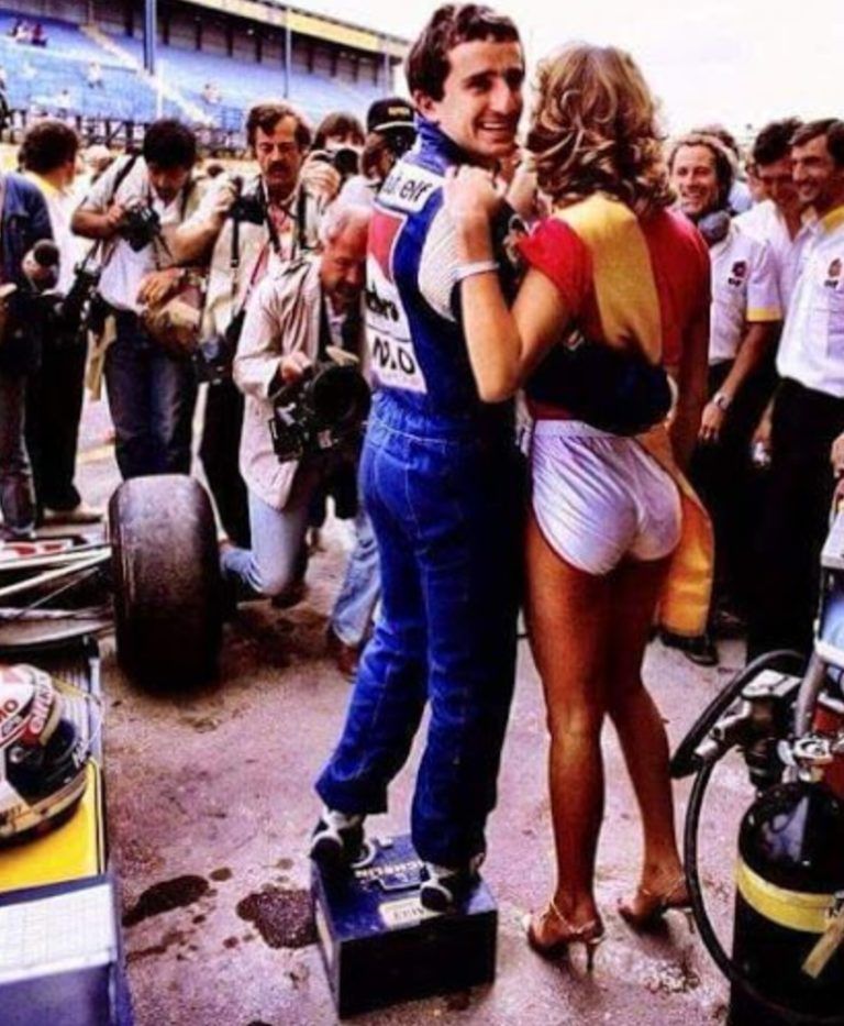 Alain Prost, Renault, with a girl in 1983.