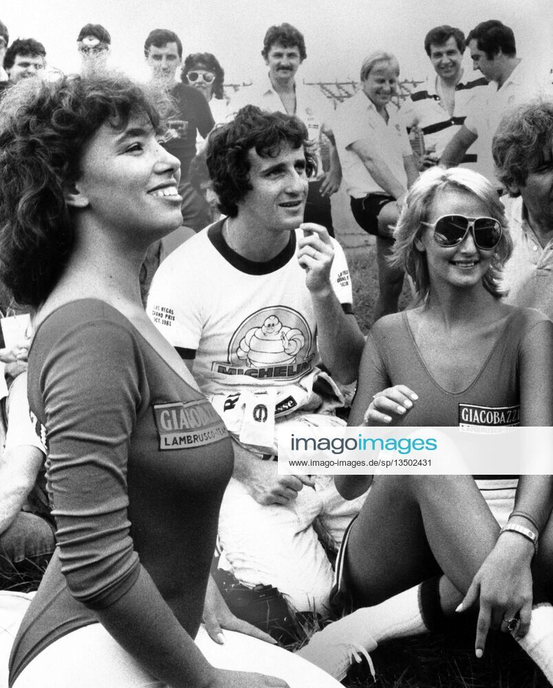 Alain Prost with two Giacobazzi Lambrusco promo girls on 11 October 1983.