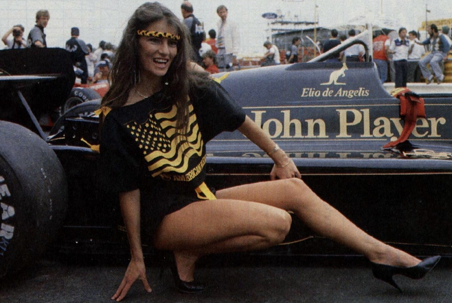 A girl in front of Elio de Angelis’ Lotus 95T in 1984.