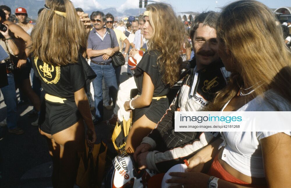 Nigel Mansell, Lotus, among John Player Special promotional girls during the Brazilian Grand Prix on 25 March 1984.