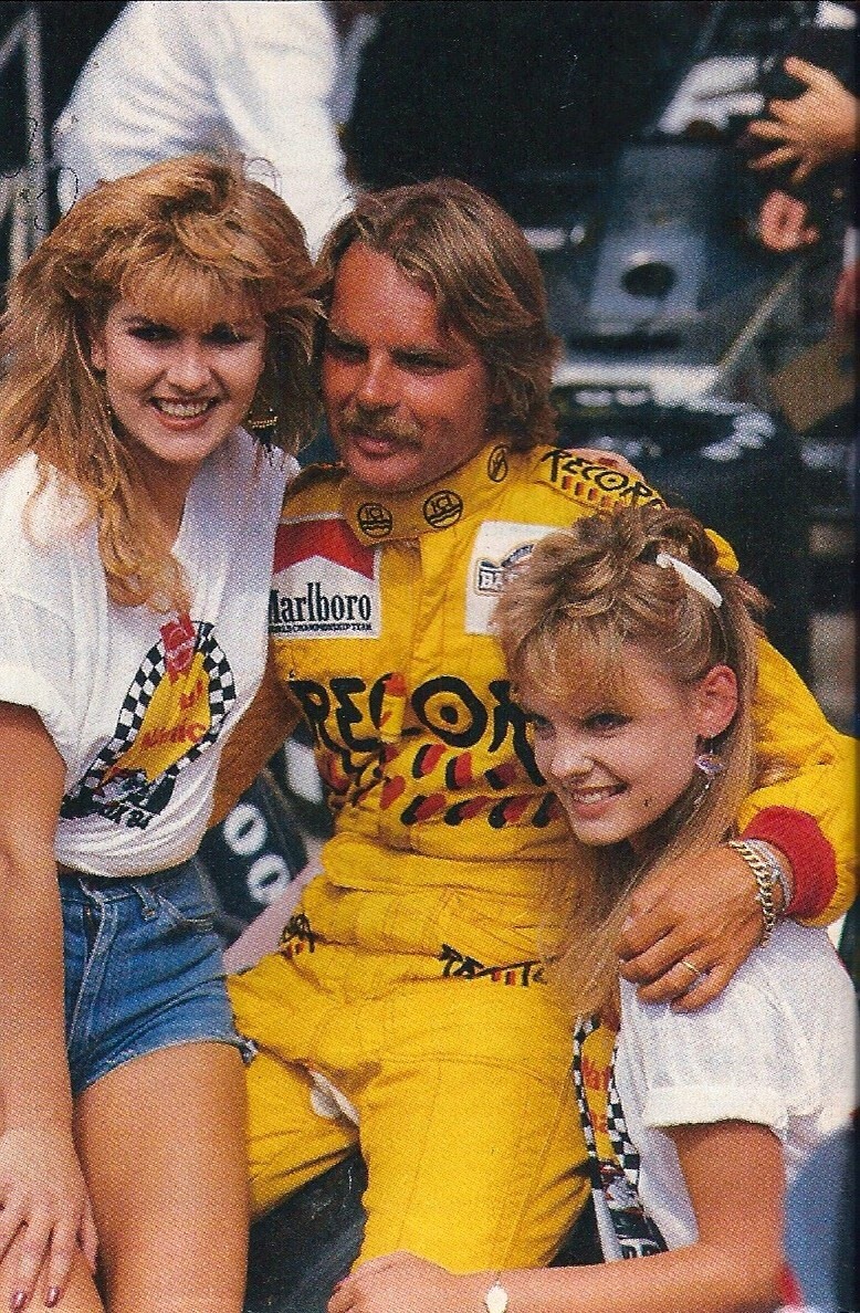 Keke Rosberg with two girls at the South African Grand Prix on 07 April 1984.