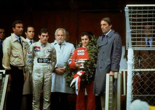 Alain Prost, 1st position, Ayrton Senna, 2nd position and Prince Rainier on the podium at the Monaco Grand Prix in Monte Carlo on 03 June 1984.