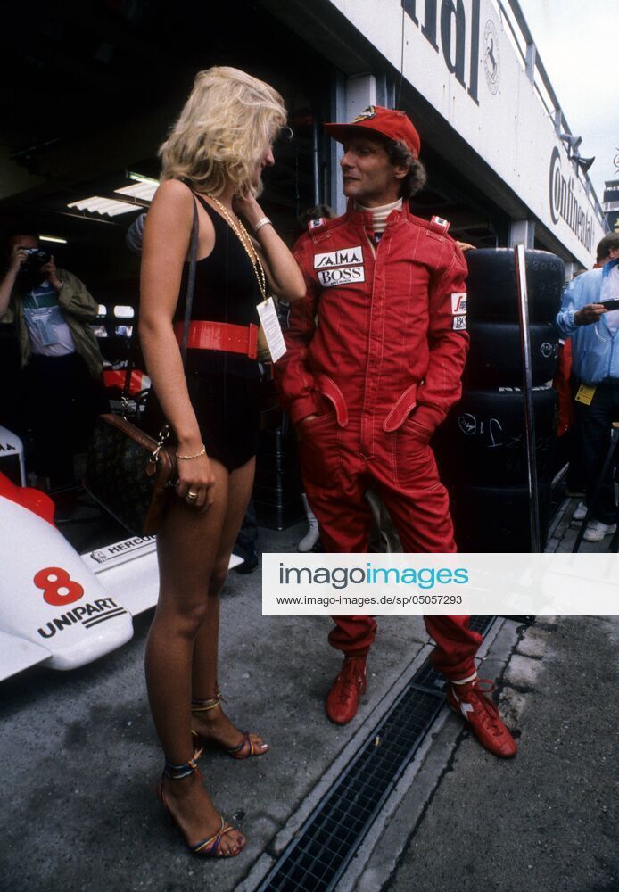 Niki Lauda, McLaren TAG Porsche, with a girl at the Austrian Grand Prix on 19 August 1984.