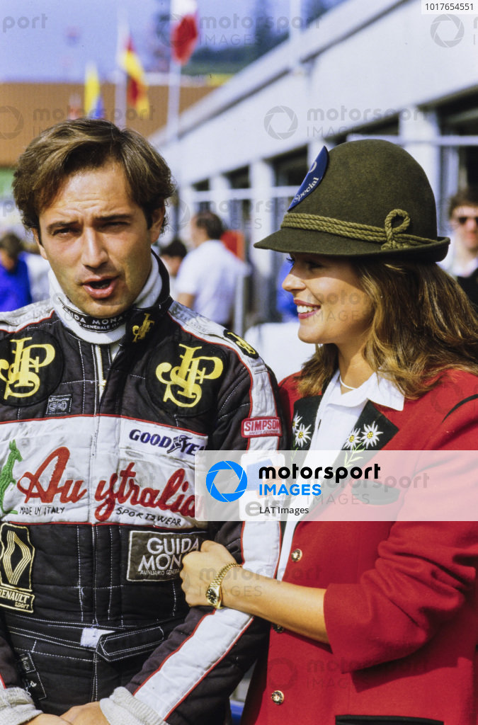 Elio de Angelis, Lotus 95T Renault, with fashion model girlfriend Ute Kittelberger at the Austrian Grand Prix on 19 August 1984.