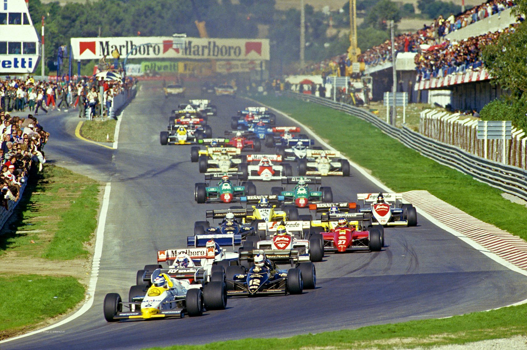 Keke Rosberg, Williams FW09B Honda, leads at the start of the Portuguese Grand Prix on Sunday 21 October 1984. 