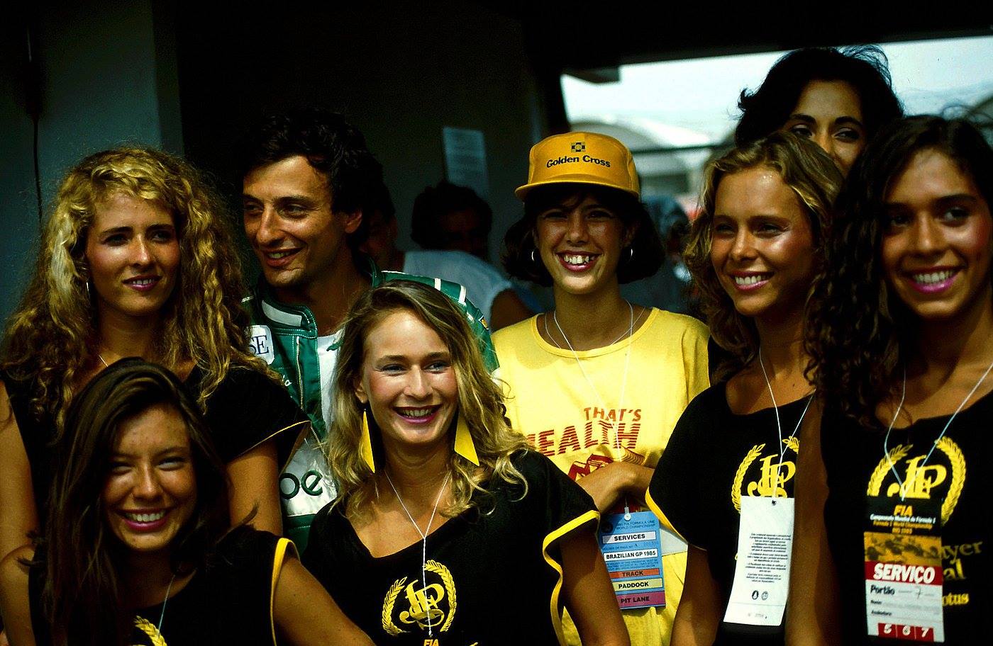 Riccardo Patrese with the JPS girls at the Brazilian Grand Prix in Jacarepaguá, Rio de Janeiro, on 07 April 1985.