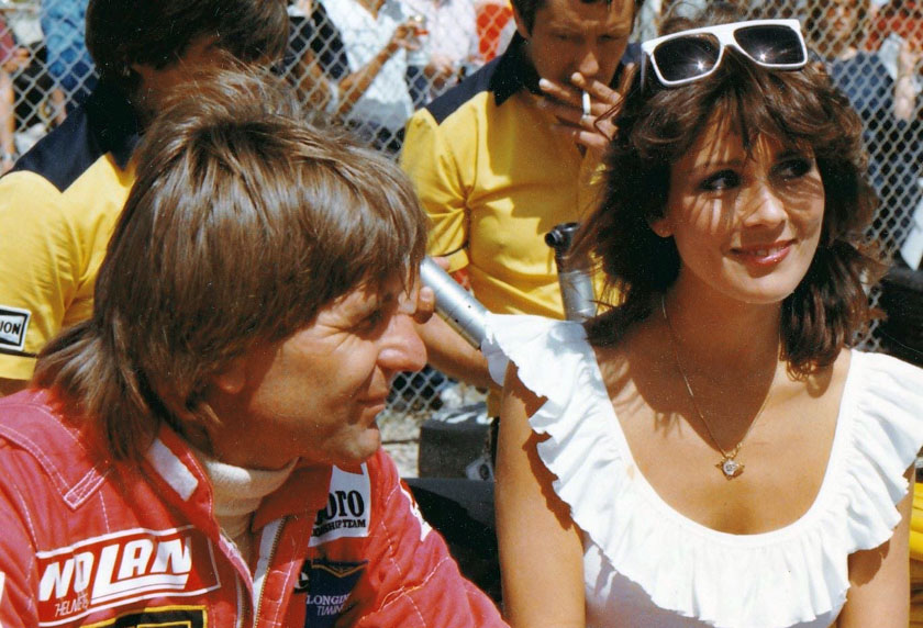 Manfred Winkelhock with a girl at the Detroit Grand Prix on 23 June 1985. 
