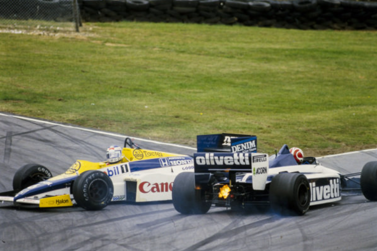 Keke Rosberg, Williams FW10 Honda, spins and collects a flaming Nelson Piquet, Brabham BT54 BMW, at the European Grand Prix at Brands Hatch on 06 October 1985.