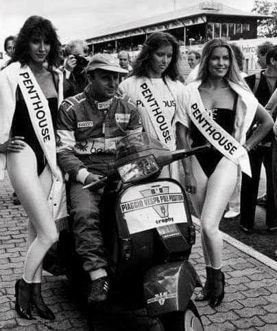 Teo Fabi celebrates with three Penthouse girls the pole position obtained for Benetton at the Italian Grand Prix in Monza on 07 September 1986.