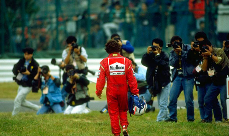 Alain Prost walks away from the scene of his collision with Ayrton Senna at Suzuka in 1989.