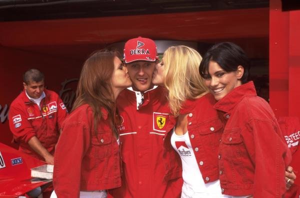 Michael Schumacher is kissed by the Marlboro girls at the Belgian Grand Prix in Spa on 30 August 1998. 