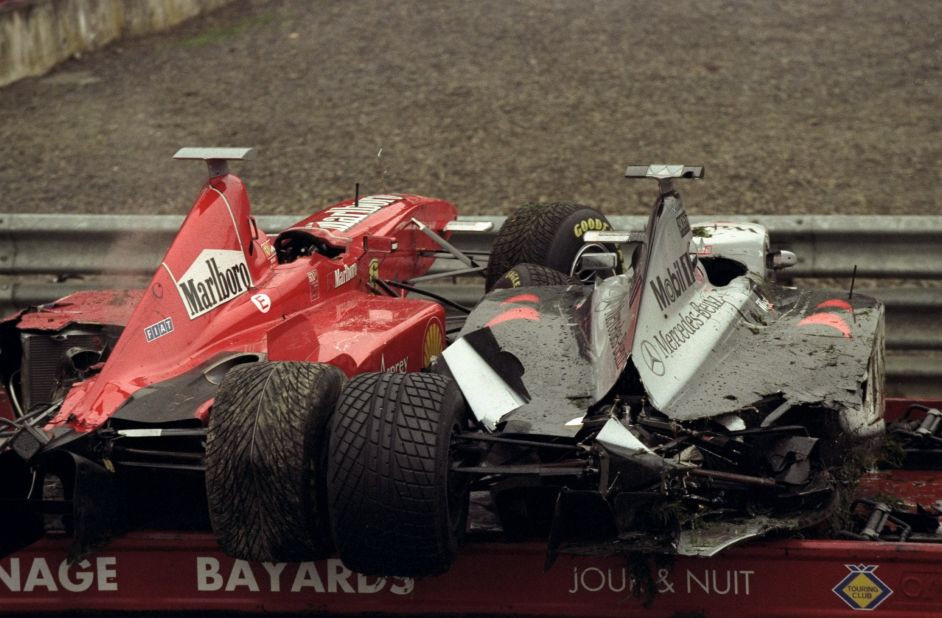 The Ferrari of Eddie Irvine and the McLaren Mercedes of David Coulthard loaded on a recovery vehicle after the crash at the Belgian Grand Prix on 30 August 1998.